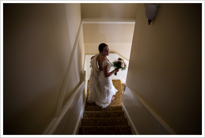 Bride going down stairs | Wentworth by the Sea wedding New Hampshire LAD Photography