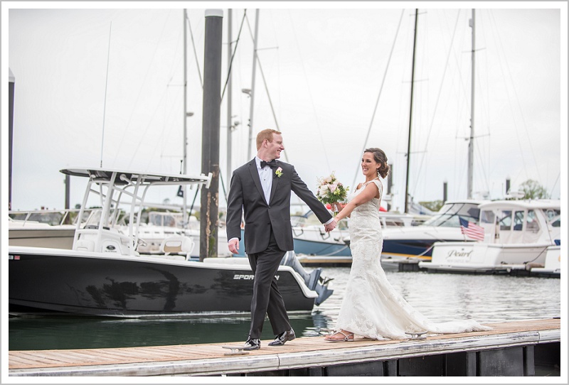 Bride and Groom walk down the dock | Wentworth by the Sea wedding New Hampshire LAD Photography