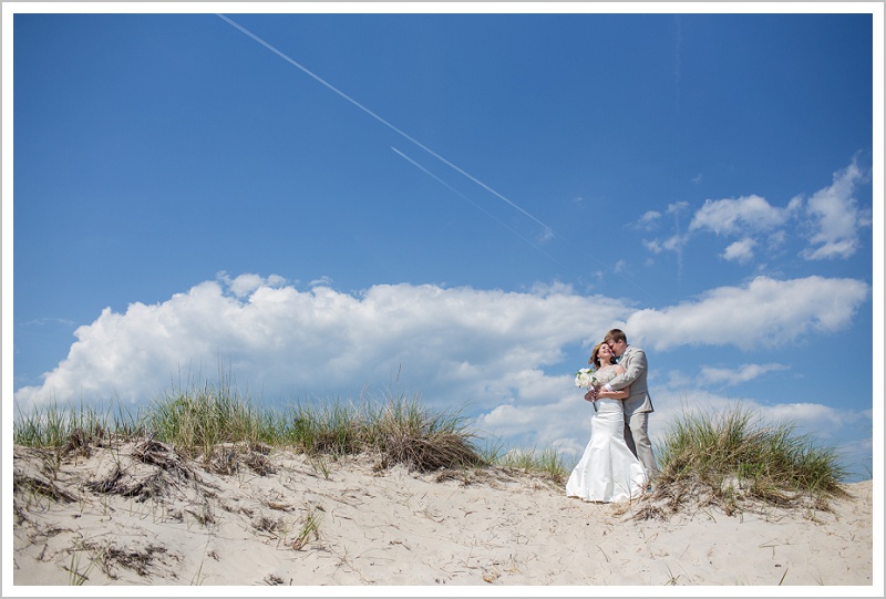 Bride and Groom on the beach | Joseph and Breanne's Village by the Sea Wedding