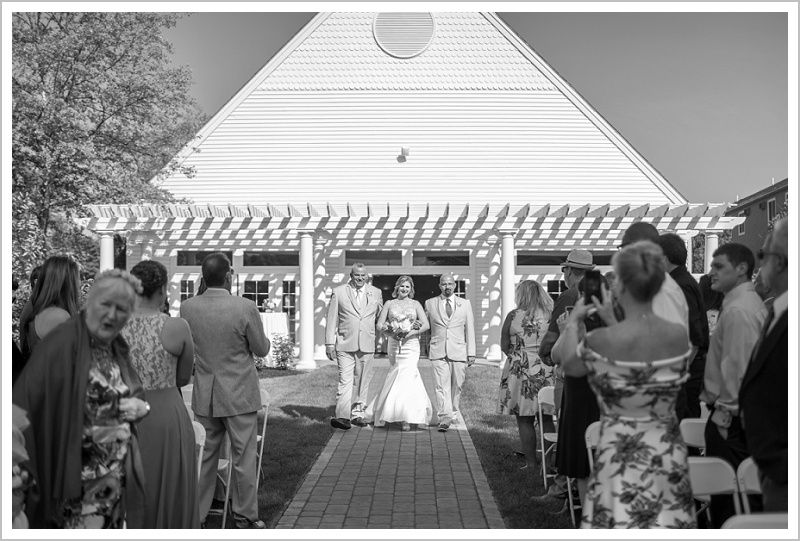 Walking bride down the isle | Joseph and Breanne's Village by the Sea Wedding