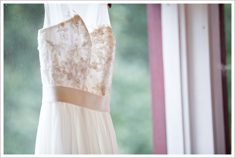 Tyler + Leanne Wedding at Stone Mountain Arts Center - Dress in window