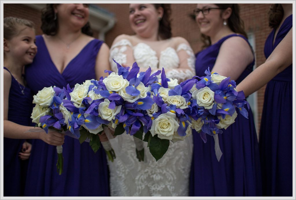 Bride and Bridesmaids in Purple and holding bouquets