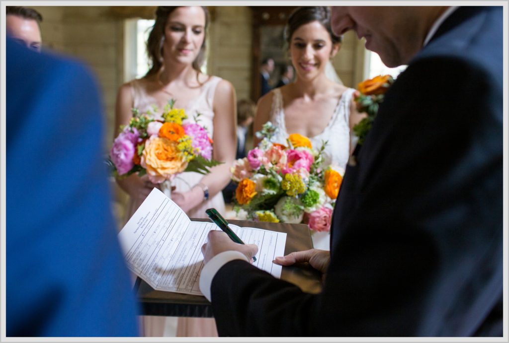 Katie and James' Hidden Pond Wedding | Signing the certificate