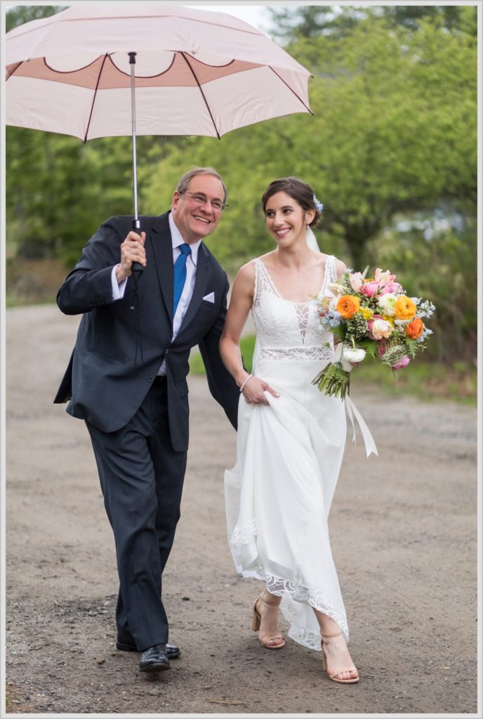 Katie and James' Hidden Pond Wedding | bride and father under umbrella