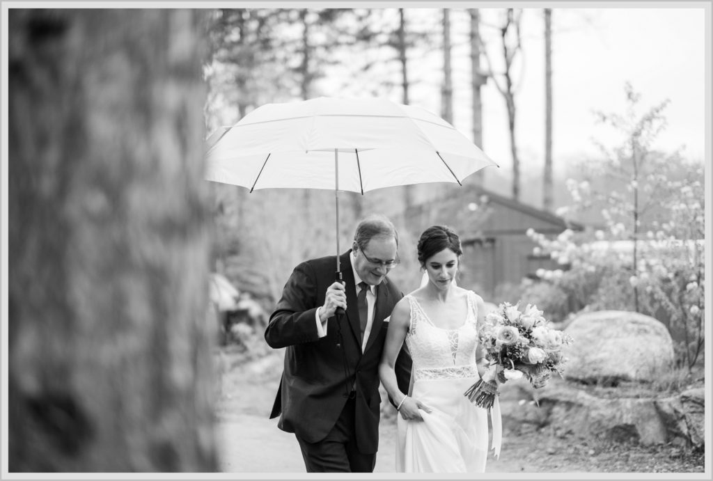 Katie and James' Hidden Pond Wedding | bride and father under umbrella