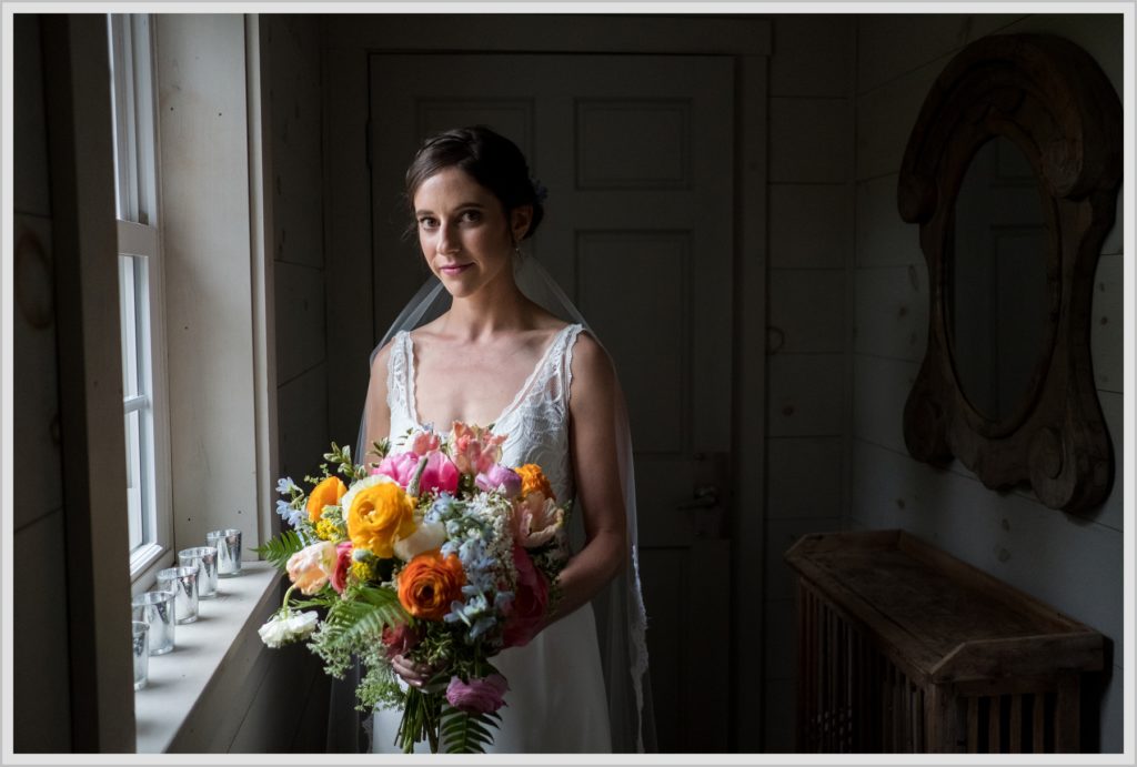 Katie and James' Hidden Pond Wedding | bride near window