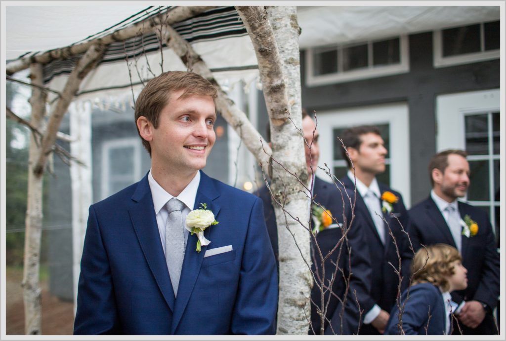 Katie and James' Hidden Pond Wedding | groom reacts to bride coming down the isle