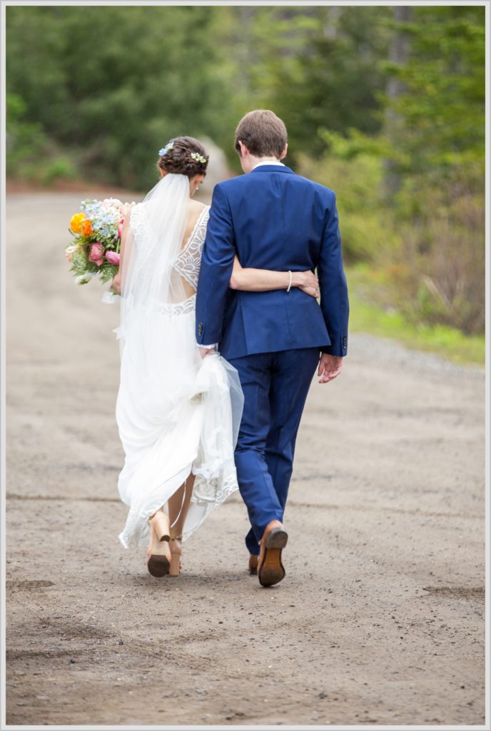 Katie and James' Hidden Pond Wedding | Bride and groom share quiet walk