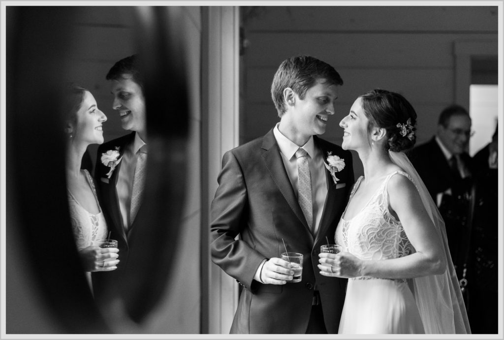 Katie and James' Hidden Pond Wedding | bride and groom and reflection in mirror