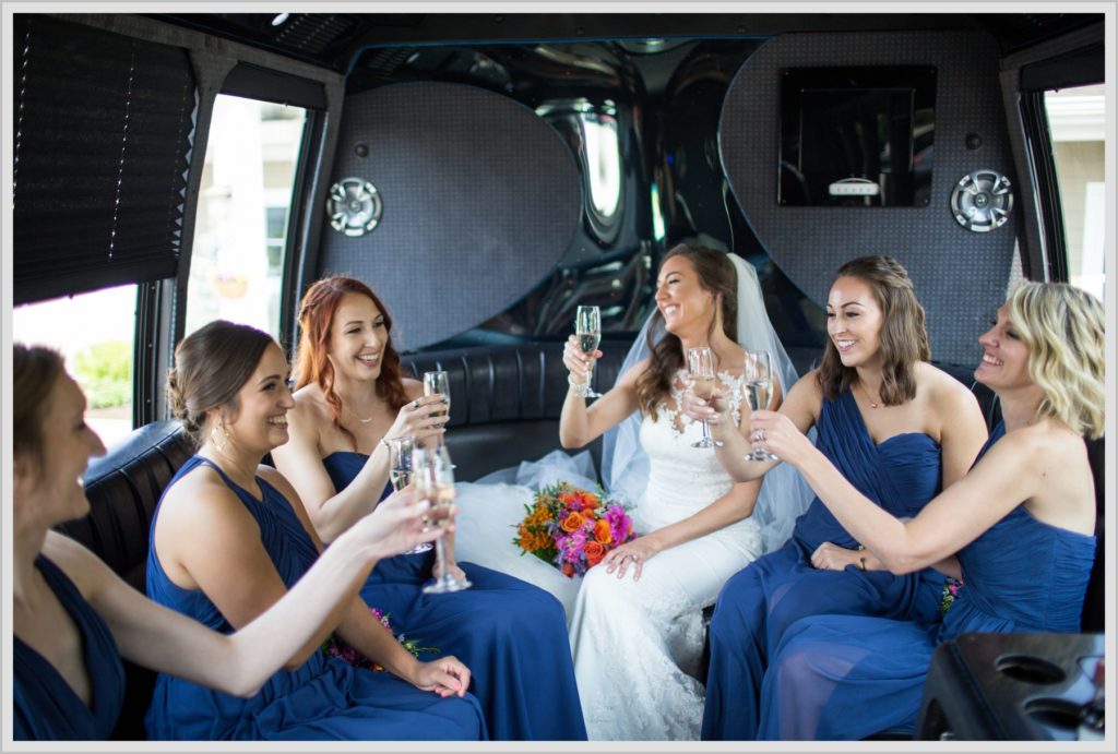 Dan and Amanda's Stone Mountain Arts Center Wedding Featured in Real Maine Weddings | Bride and Bridesmaids in limo