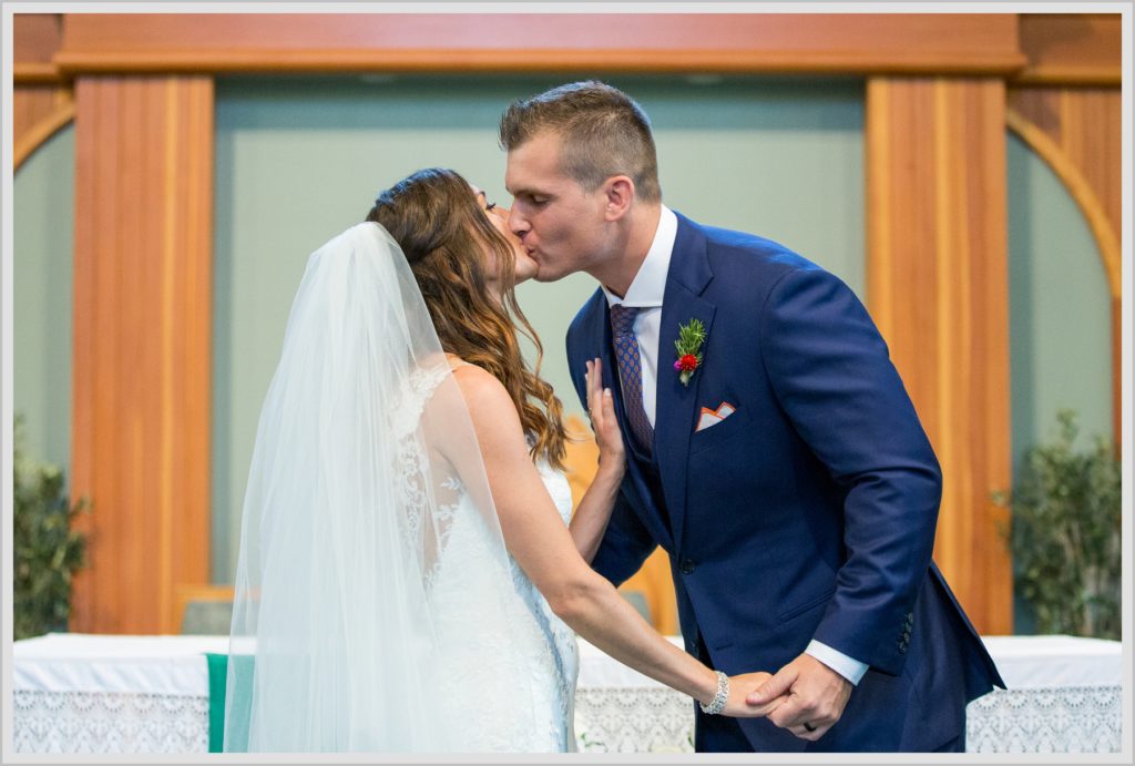 Dan and Amanda's Stone Mountain Arts Center Wedding Featured in Real Maine Weddings | The kiss