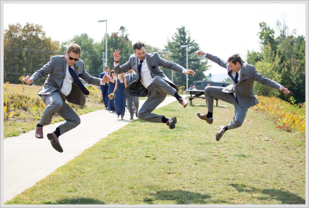 Dan and Amanda's Stone Mountain Arts Center Wedding Featured in Real Maine Weddings | Groomsmen jumping