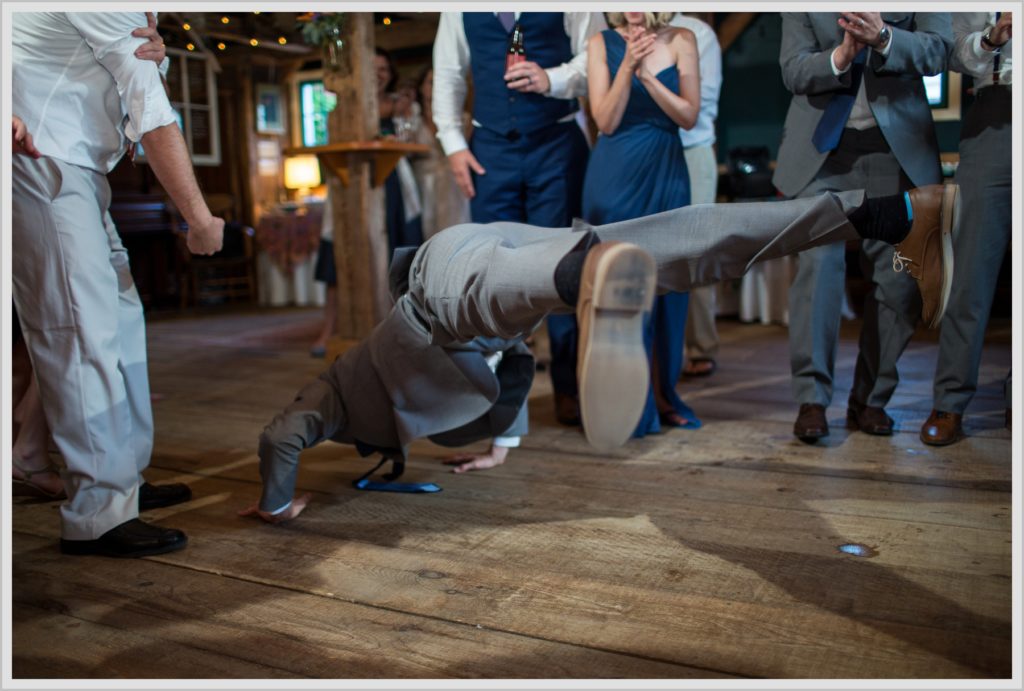 Dan and Amanda's Stone Mountain Arts Center Wedding Featured in Real Maine Weddings | groomsman doing the worm