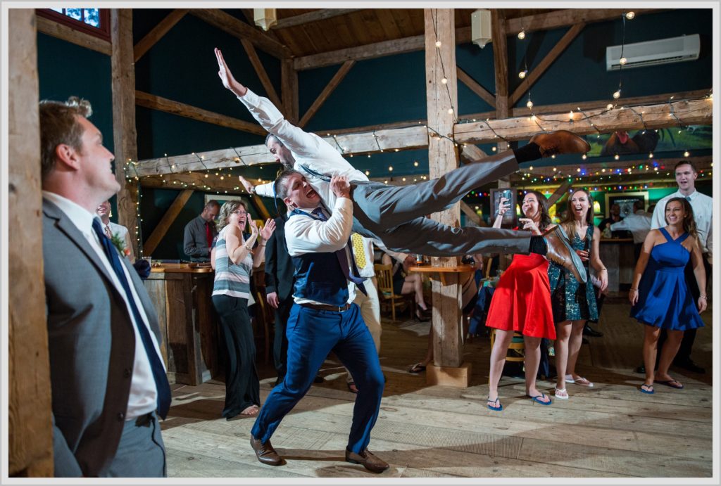 Dan and Amanda's Stone Mountain Arts Center Wedding Featured in Real Maine Weddings | reception dancing, groom practicing lift with groomsman