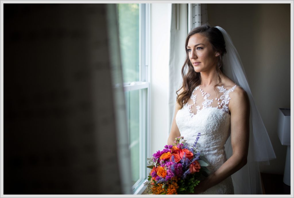 Dan and Amanda's Stone Mountain Arts Center Wedding Featured in Real Maine Weddings | Bride by window