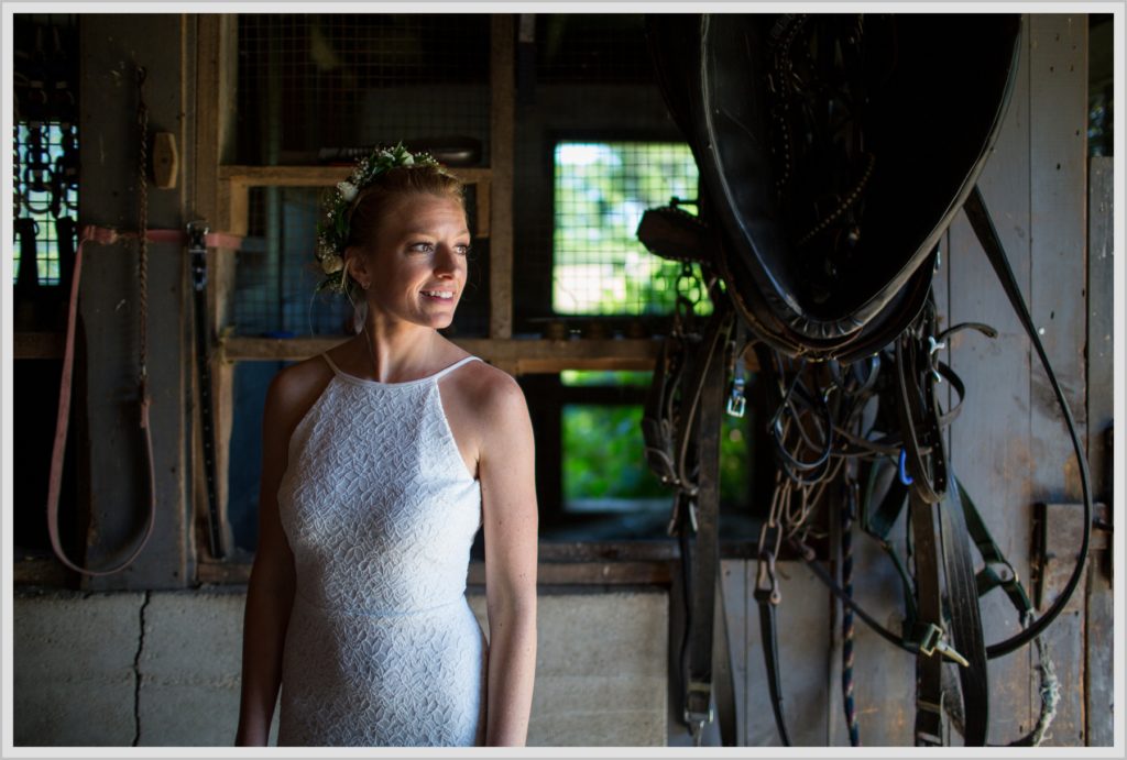 Ryan and Becca's New Hampshire Farm Wedding | bride in horse barn