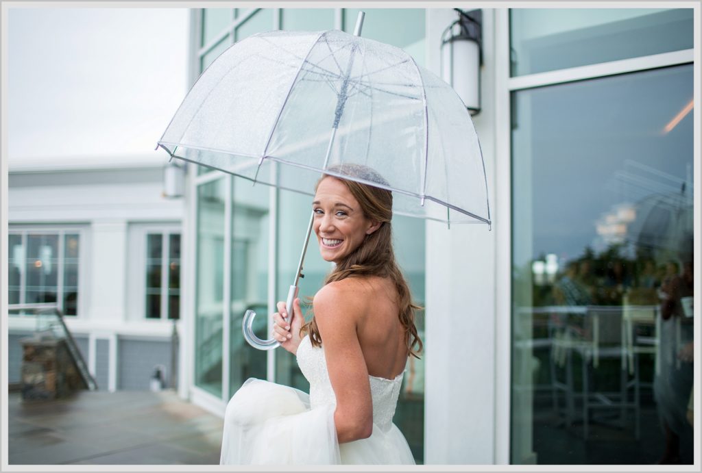 Brian + Tracy's Cliff House Wedding | Bride and umbrella