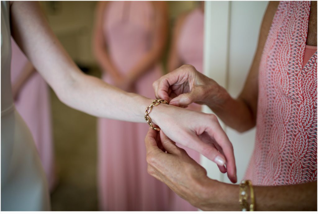 Brian + Liz’s Maine Wedding | Putting on the bracelet