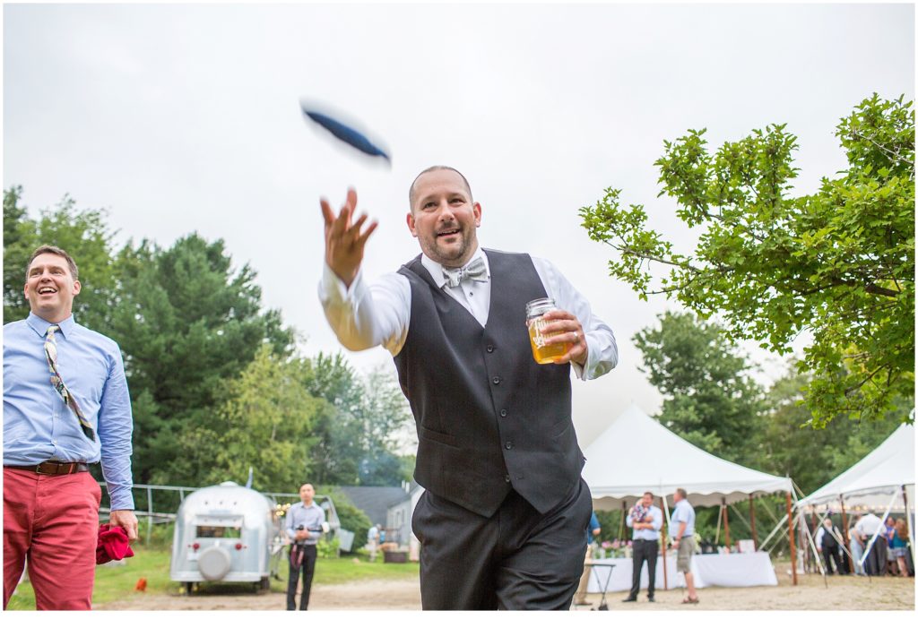 Britt and Jason Funky Bow Wedding | Groom playing cornhole