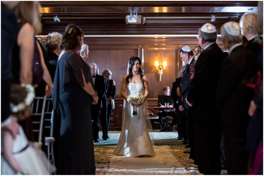 Bride coming down the Aisle | Jewish Wedding at Boston Harbor Hotel on New Years Eve