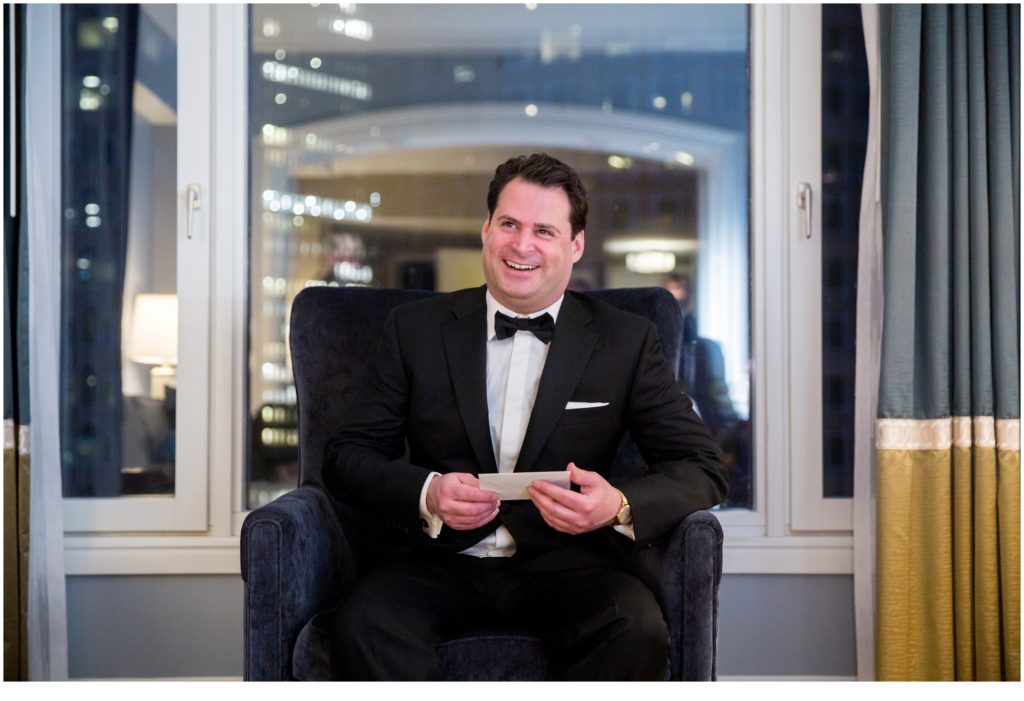 Groom Reading note from bride | Jewish Wedding at Boston Harbor Hotel on New Years Eve