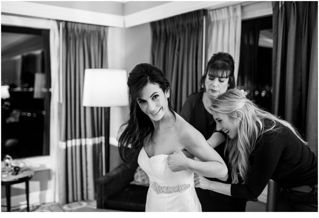 Getting the dress on | Jewish Wedding at Boston Harbor Hotel on New Years Eve